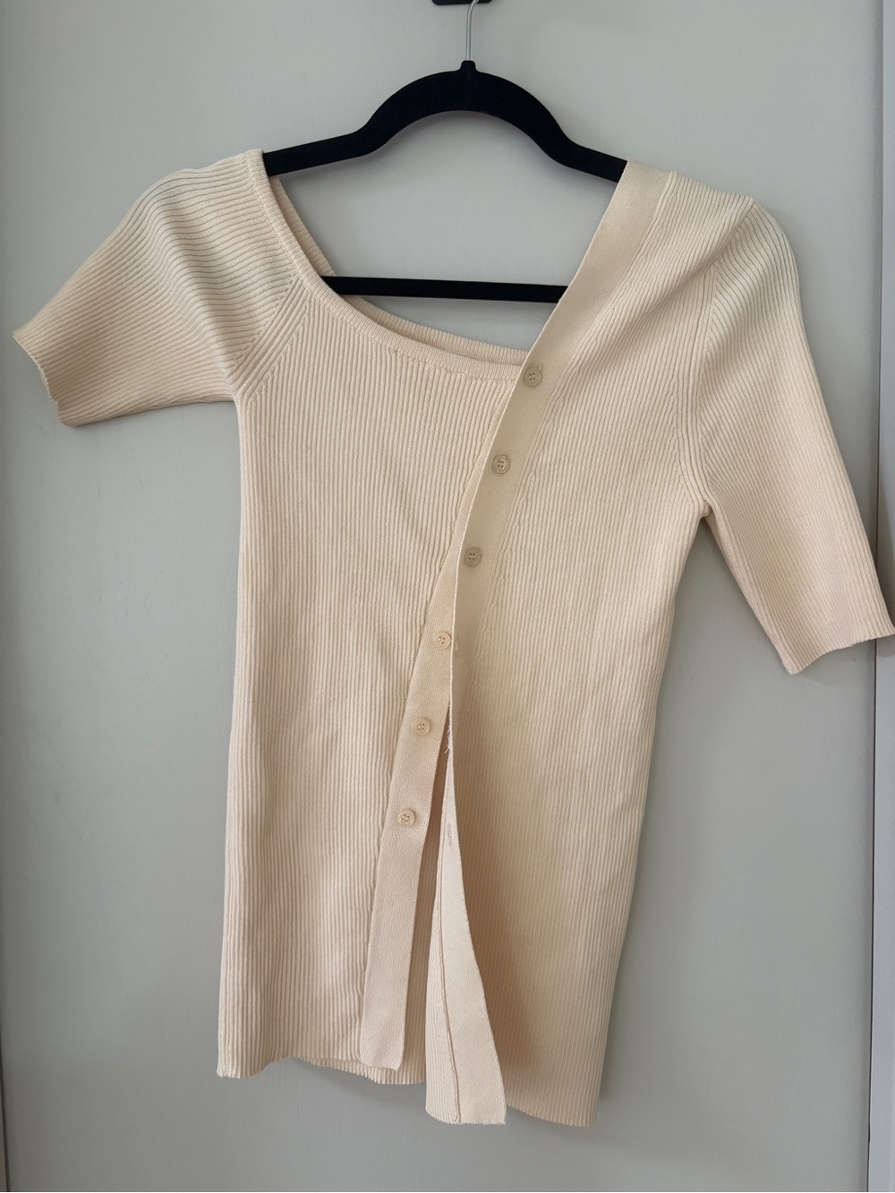 Pixie Mart Drie Asymmetric Button Ribbed Off-the-Shoulder Button-Front Knit Top